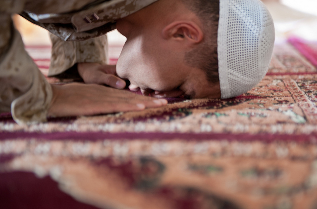 A boy is prostrating in prayer. - Ramadan